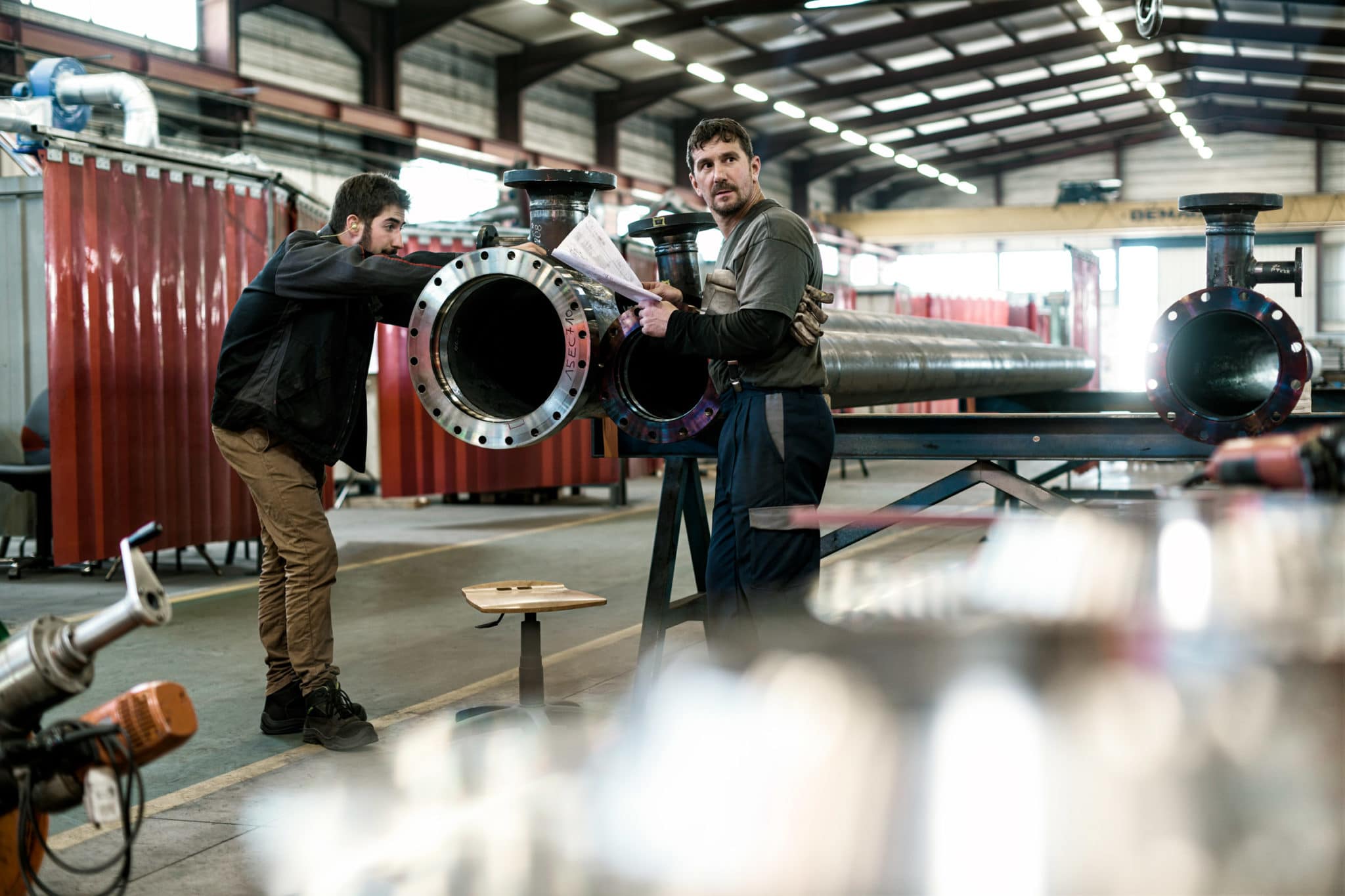 Photographe sur site de production. AIT STEIN GROUP.