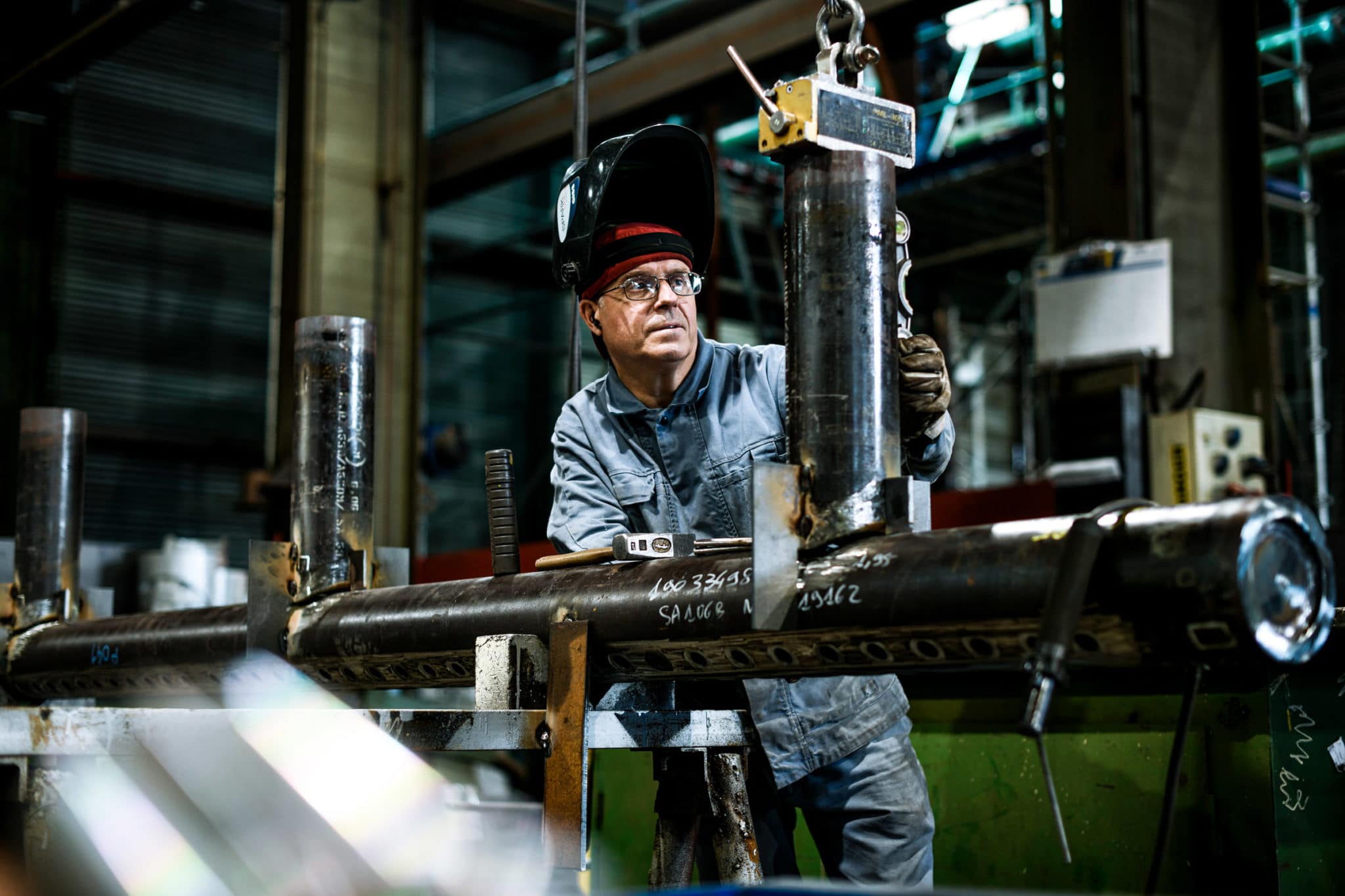 Photographe sur site de production. AIT-STEIN GROUP.